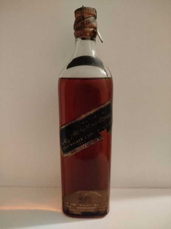 Johnnie Walker Extra Special Highland Whisky, no size, no abv; Guaranteed Over 12 years Old, By appointment to the late King George V