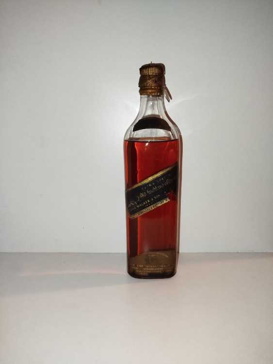 Johnnie Walker Extra Special Highland Whisky, no size, no abv; Guaranteed Over 12 years Old, By appointment to the late King George V