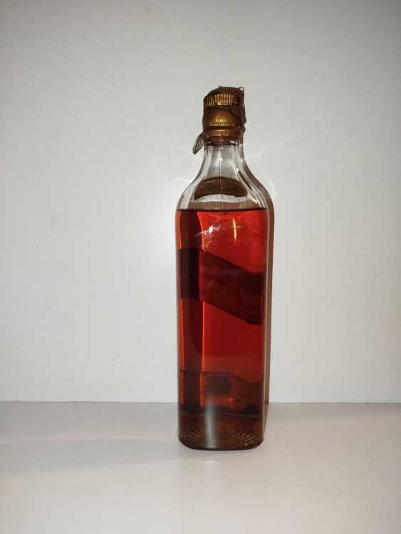 Johnnie Walker Extra Special Highland Whisky, no size, no abv; Guaranteed Over 12 years Old, By appointment to the late King George V