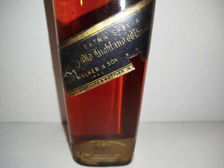Johnnie Walker Extra Special Highland Whisky, no size, no abv; Guaranteed Over 12 years Old, By appointment to the late King George V